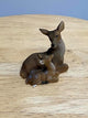 Miniature Mother Deer Sitting with Her Fawn