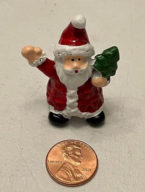 Miniature Santa Figurine Holding Christmas Tree