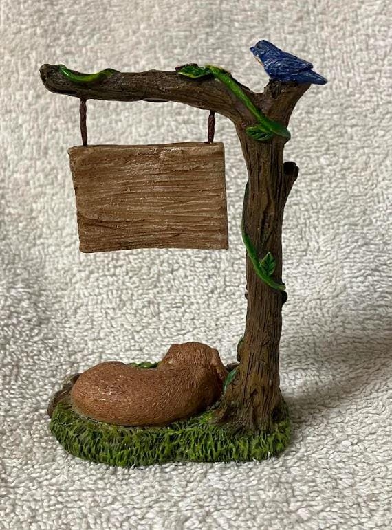 Miniature Dog Sleeping under a Welcome Sign Fairy Garden Figurine